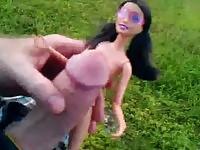 Barbie doll gets covered in cum