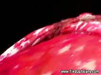 Hot slutty Asian slave endures wax and pegs